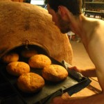 pulling bread from Dami's oven