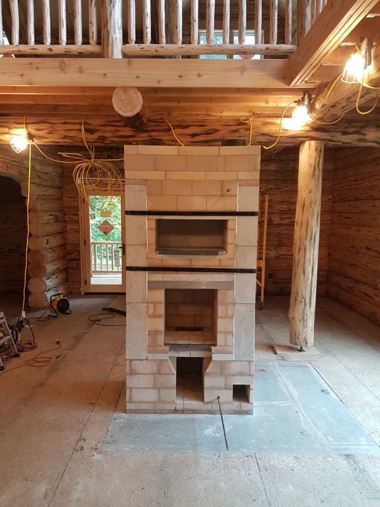Lost Creek Masonry Heater with White Oven, Wood Storage, Heated Bench, Ledge Stone